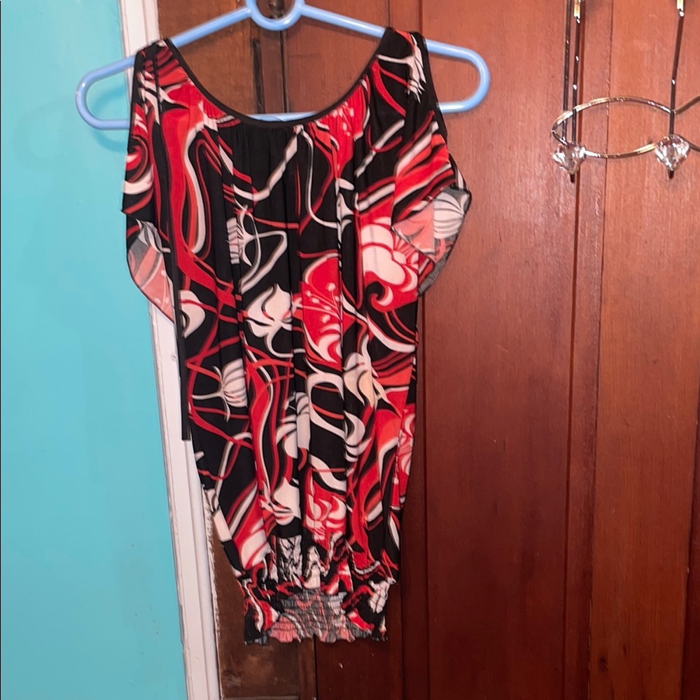 Abstract Patterned Blouse size medium color red black and elastic in the bottom